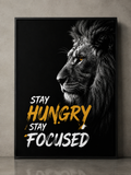 Motivational lion wall art with 'Stay Hungry Stay Focused' quote in bold yellow and white text on black background